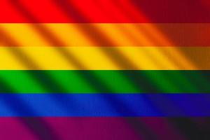 The gay pride rainbow flag with shadows and copy space. Gay pride movement. photo