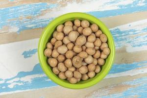 bowl with soy beans on blue rustic wooden table photo