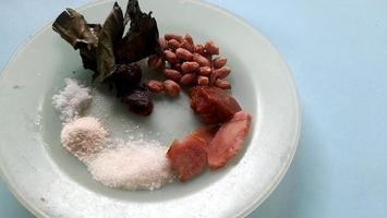 various spices for cooking fried chicken with blue background photo