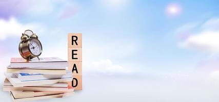 World book day, stack of books with glasses on mint background photo