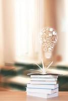 World book day, stack of books with glasses on mint background photo