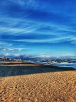 calm seaside landscape of san juan beach in alicante spain on a sunny day photo