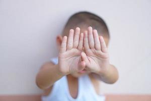 Boys raise their hands to prevent violence against children. photo