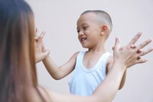 boy holding hands with mother happy smile photo