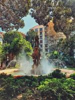 urban summer landscape of Alicante fuente la aguadora with photo and trees in spain