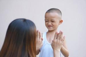 boy holding hands with mother happy smile photo