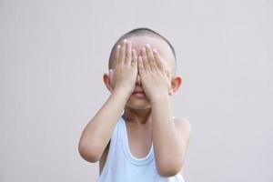 Asian boy has sore eyes photo