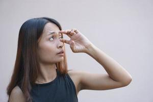 Asian woman has sore eyes photo