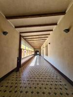 long corridor in historic building architecture background photo