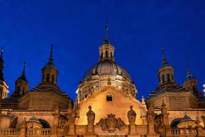 historic cathedral Zaragoza at night and summer evening photo