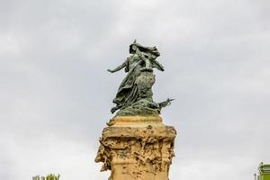 interesting monument in Zaragoza in a park on a cloudy day photo