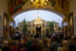 .Many people in the temple celebrate Palm Sunday. Orthodox believers. A crowd of residents in the church. photo