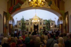 .Many people in the temple celebrate Palm Sunday. Orthodox believers. A crowd of residents in the church. photo