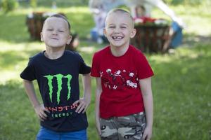 Two cheerful preschooler boys. Friends in kindergarten. The kids are laughing. photo