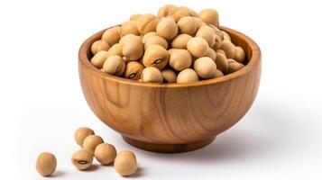 A wooden bowl of soya beans or soybean isolated on white. photo