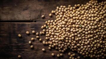 A pile of soya beans or soybean wooden background copy space studio presentation flat lay. photo