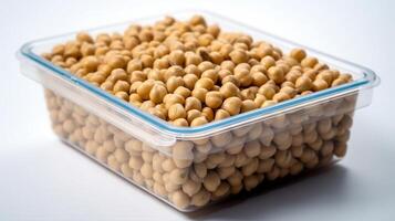 A plastic container of soya beans or soybean isolated on white. photo