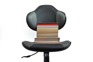 Books on the chair with white background photo