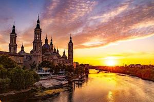 picturesque sunset on a summer day in the city of Zaragoza in Spain overlooking the river and the cathedral photo