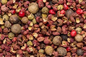 Various mixture of peppers, red, black and allspice. Seasoning for cooking photo