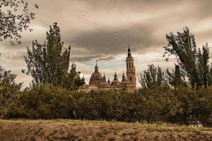 landscape from the spanish city of saragossa with basilica and trees photo