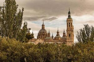 landscape from the spanish city of saragossa with basilica and trees photo