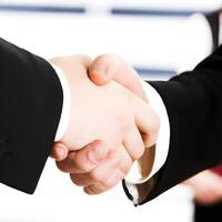 Two business people shaking hands. . photo