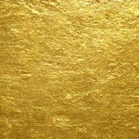 gold texture background. close up of shiny surface of gold. golden smooth material. gold leaf. . photo