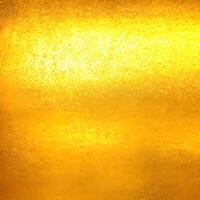 gold texture background. close up of shiny surface of gold. golden smooth material. gold leaf. . photo