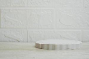 Minimalistic empty white podium on white background for product display photo