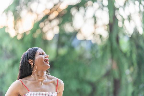 Distracted Transgender happy woman in a park 22567117 Stock Photo