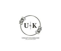 initial UK letters hand drawn feminine and floral botanical logo suitable for spa salon skin hair beauty boutique and cosmetic company. vector