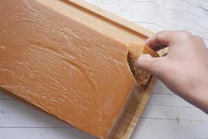 Jaggery traditional cane sugar cube on table photo