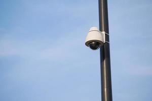 CCTV Security system for home against blue sky photo