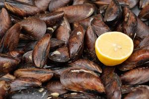 Thai mussels in metal on table top view photo