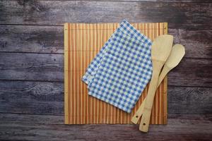 blue color table napkin on wooden table photo