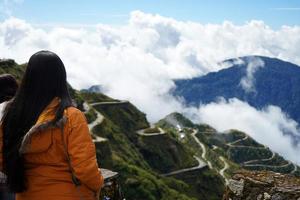 Girl Tourist getting the View of Zig Zag Road of Old Silk Route East Sikkim photo