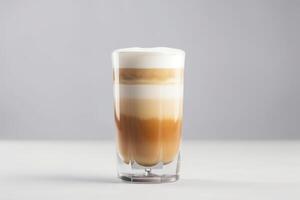 un latté macchiato en un glas en un blanco antecedentes creado con generativo ai tecnología. foto