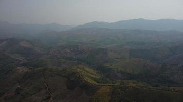 Aerial view of mountains covered in haze from burning forests. Areas with dense smog and covered with PM2.5. Air pollution and ecological problems. video