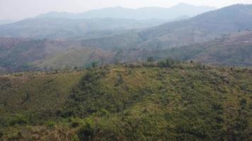 Aerial view of mountains covered in haze from burning forests. Areas with dense smog and covered with PM2.5. Air pollution and ecological problems. video