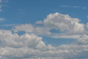 Cover page with soft blue sky with illuminated clouds as a background. photo