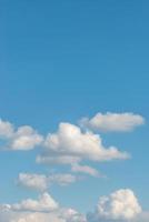 Cover page with soft blue sky with illuminated clouds as a background. photo