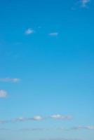 Cover page with blue deep sky with clouds as a background with copy space. photo