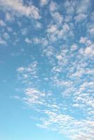 Cover page with soft blue sky with illuminated clouds as a background. photo