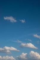 Cover page with soft blue sky with illuminated clouds as a background. photo