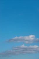 Cover page with blue deep sky with clouds as a background with copy space. photo