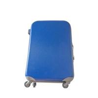 Big travel blue suitcase as a hand luggage, a hard shell trolley with wheels isolated at white background. Concept of travel gears. photo