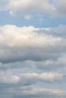 Cover page with soft blue sky with illuminated clouds as a background. photo