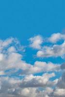 Cover page with blue deep sky with clouds as a background with copy space. photo