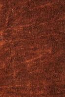 Background of brown velor fabric. Modern upholstered velvet furniture. Creative vintage background. photo